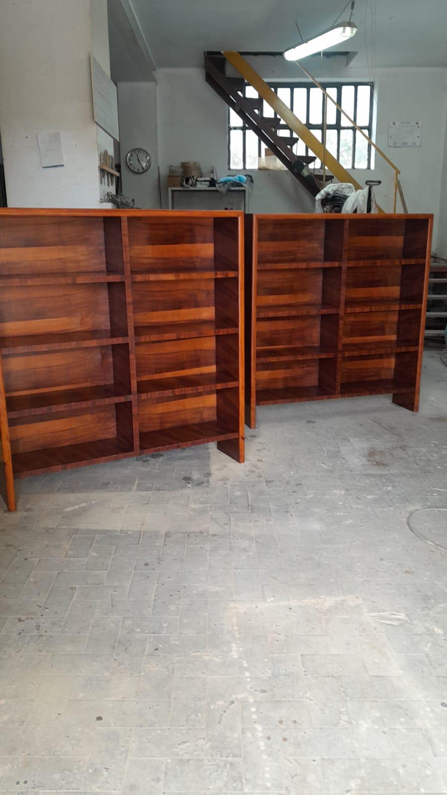 Pair of bookcase in  attributed to Osvaldo Borsani Italia 1950.Pair of bookcases with essential lines, enhanced by the use of flamed walnut and briarwood. 
The two bookcases look beautiful ,they are very decorative and  are easy to fit in  for their