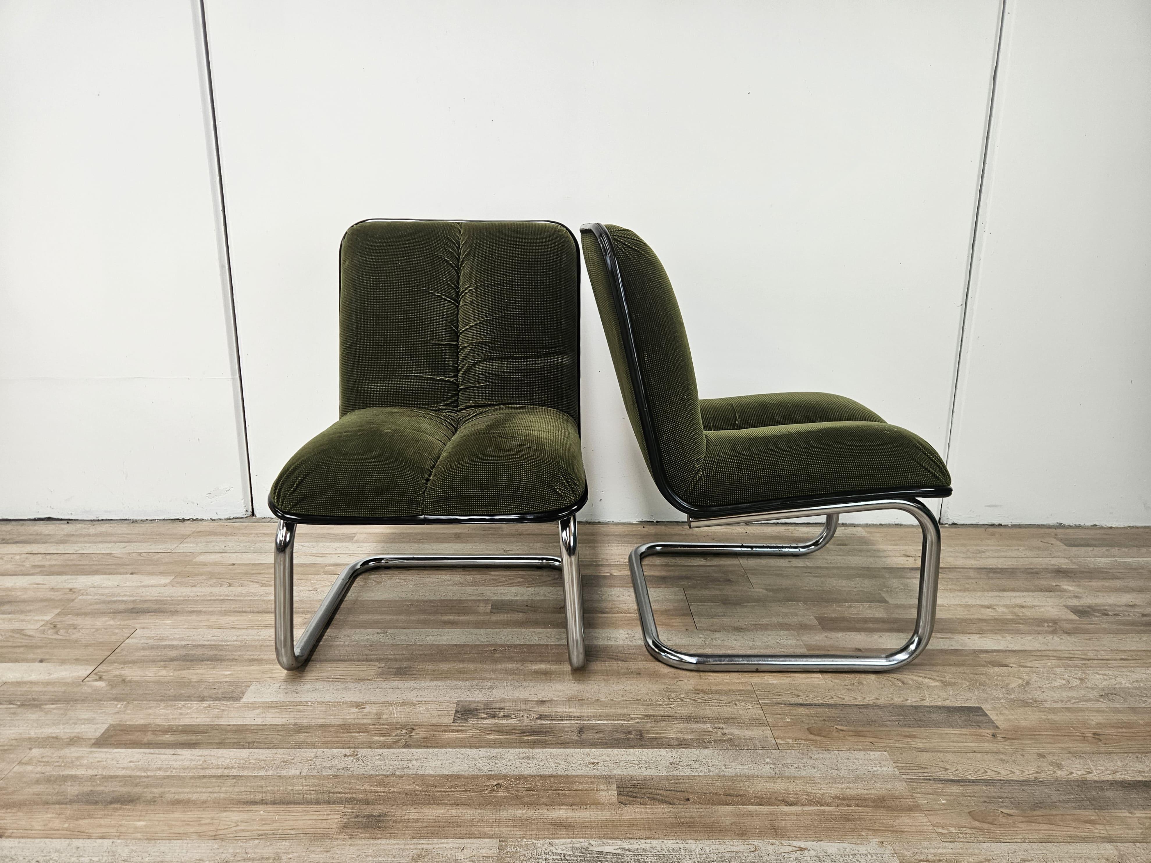 Pair of 1970s office chairs or armchairs signed Cazzaro Italy.

They feature a chrome-plated tubular metal frame and a single seat and back panel in original green fabric of the period.

As much as possible the chrome plating has been polished.
They