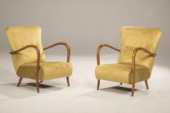 Pair of 1940s armchairs in cherry wood and green velvet