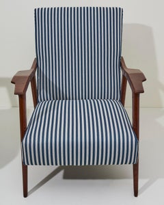 Pair of 1950s armchairs with wooden frame and fabric upholstery