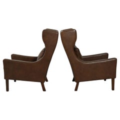 Pair of Danish dark brown leather armchairs