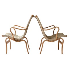 Coppia di poltrone "Eva" di Bruno Mathsson