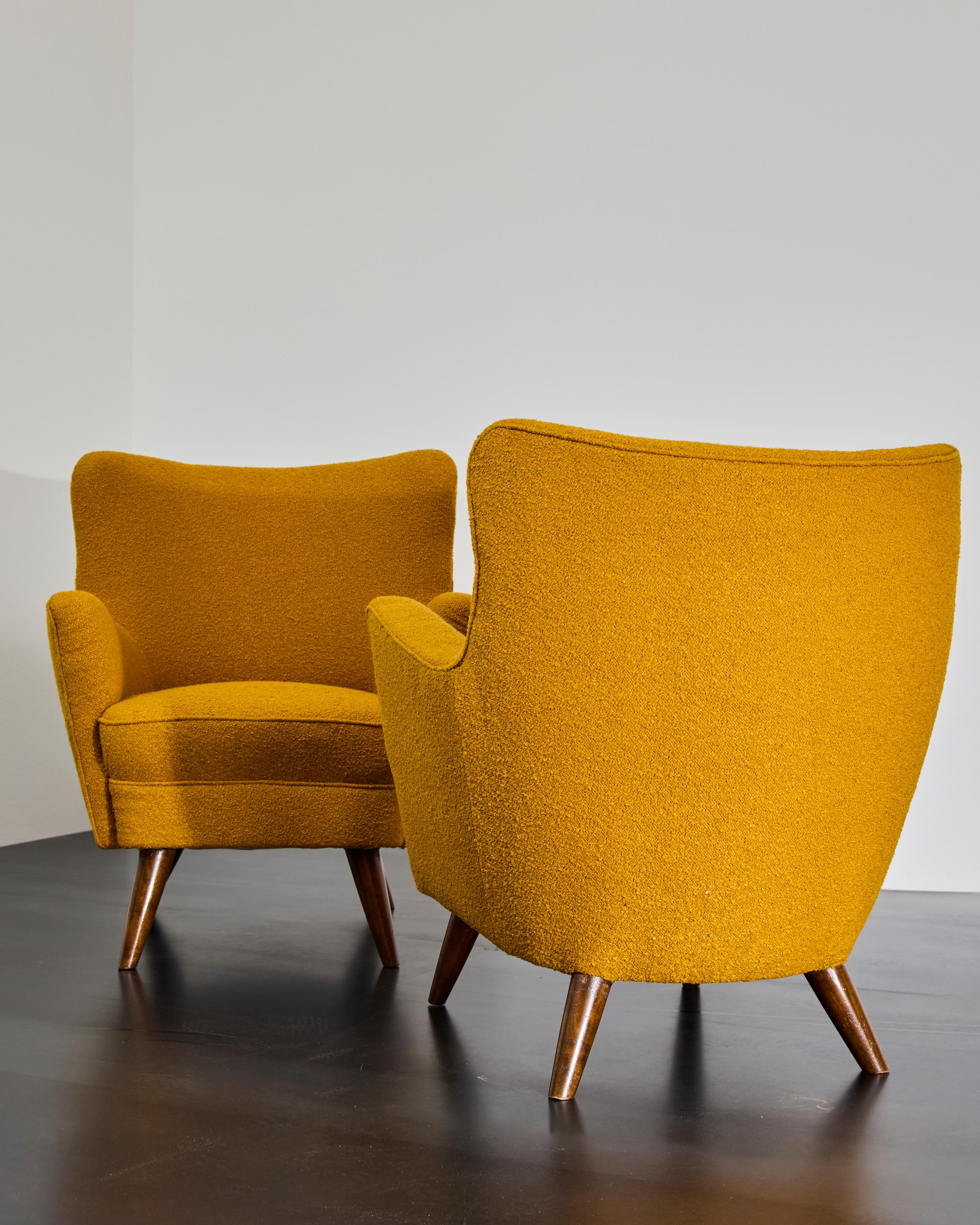 Armchairs designed by Luigi Caccia Dominioni around 1944 for a private residence in Milan; the fabric has been replaced and the wooden part of the feet, polished.