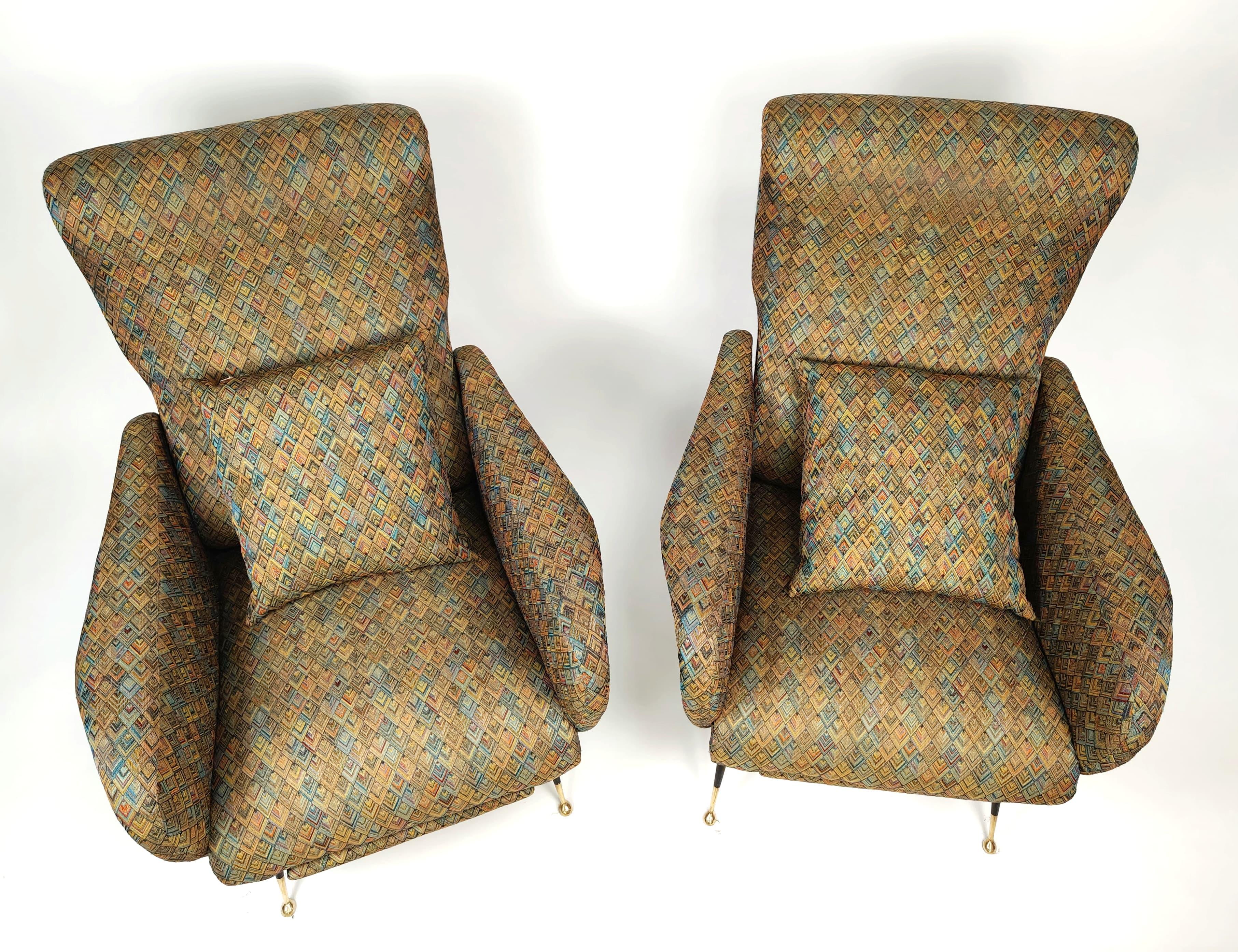 Pair of upholstered armchairs covered in Missoni-type fabric produced in Italy circa 1960s. The patterned Missoni fabric features the iconic zig-zag pattern and the multitude of motifs such as geometric figures, stripes or floral patterns, all with