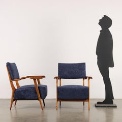 Pair of blue bellvet armchairs with wooden armrests 1950s