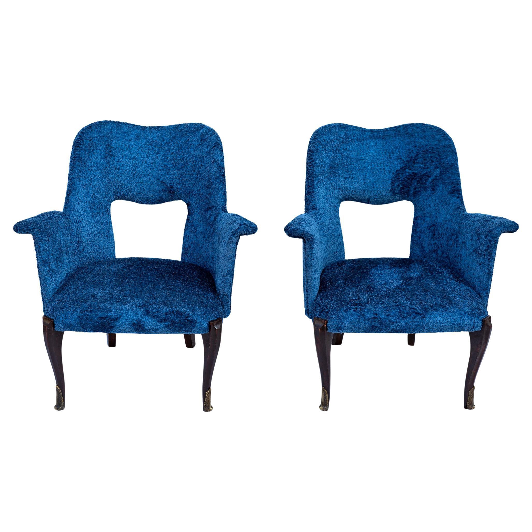 Pair of wood and bouclé armchairs, 1950s