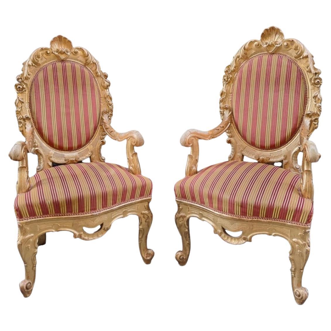 Pair of carved and gilded wooden armchairs, Rome, 19th century For Sale