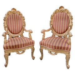 Pair of carved and gilded wooden armchairs, Rome, 19th century