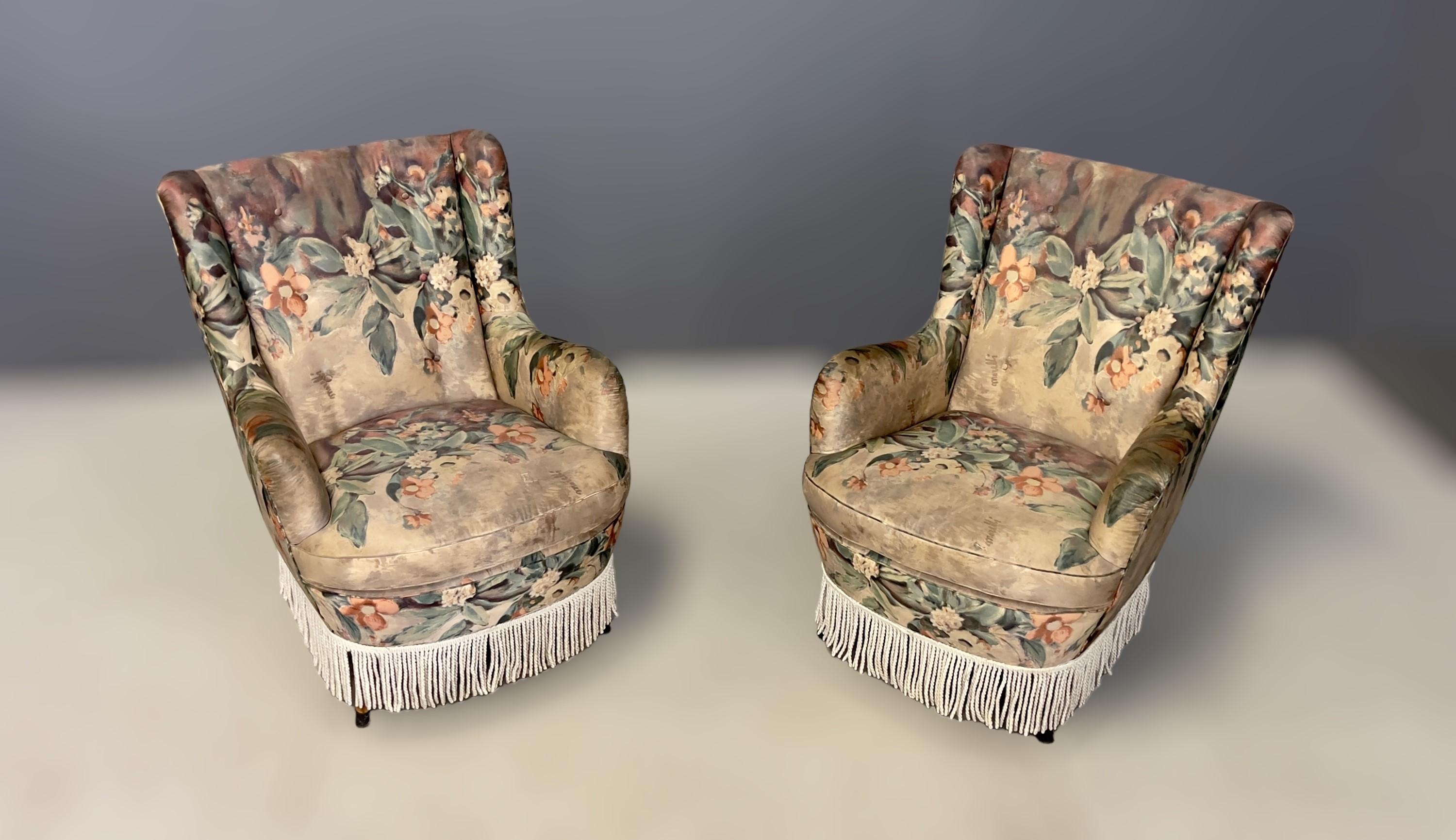 Pair of armchairs with wooden feet and original fabric upholstery of the period. Italian manufacture. C1950s