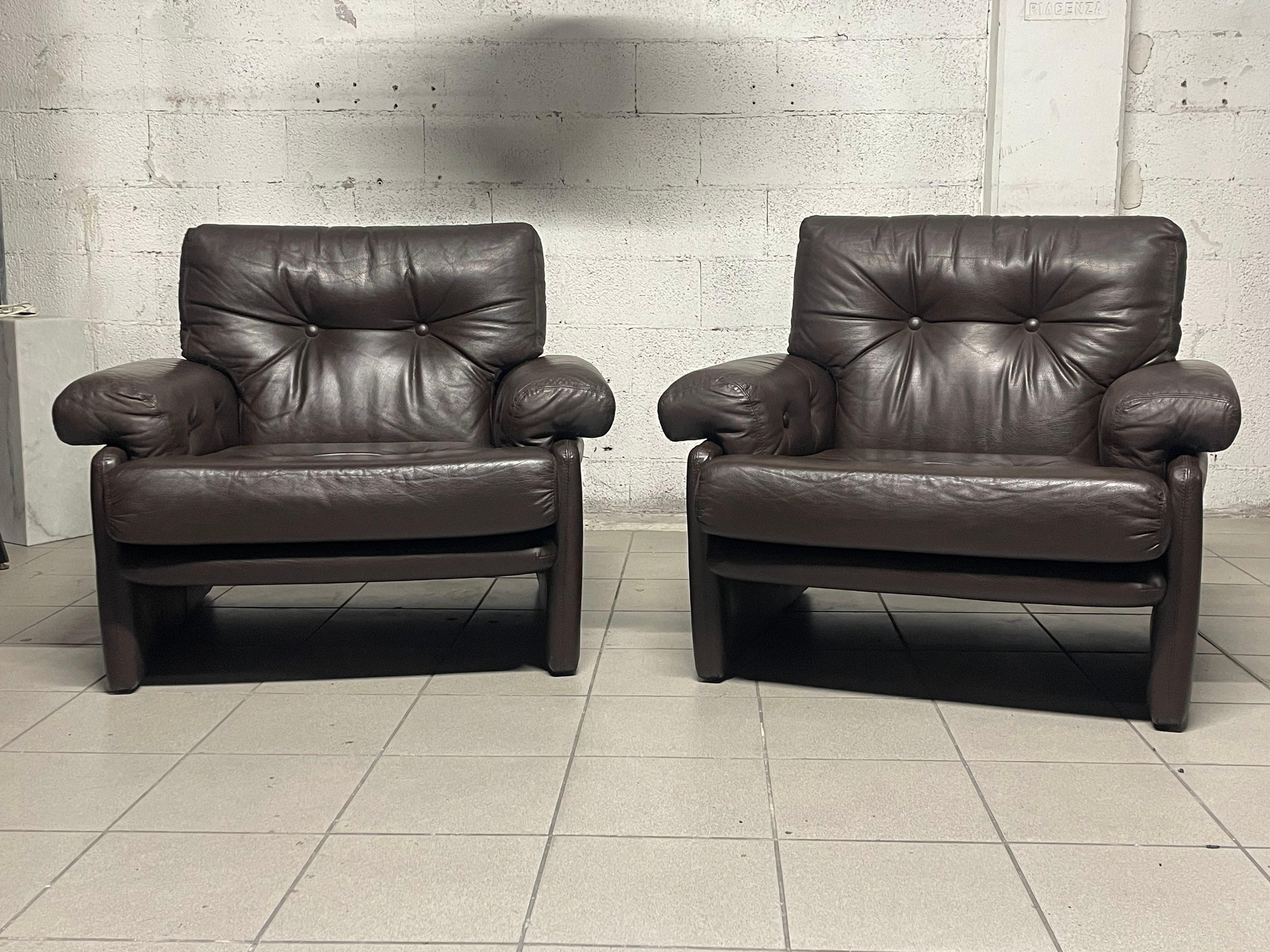 Pair of armchairs model Coronado from the 1970s by Afra & Tobia Scarpa and produced by B&B Italia.

The pair represents an icon of Italian design from that period.

Upholstery is dark brown leather still original and in excellent vintage condition.