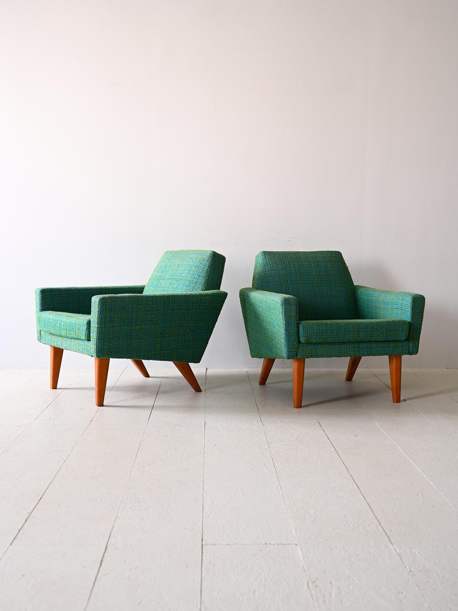Pair of original vintage armchairs from the 1960s.

Original Scandinavian-made chairs that are characterized by their original square shape with marked corners.

The green fabric is original as is the padding, still in good condition.

The feet are