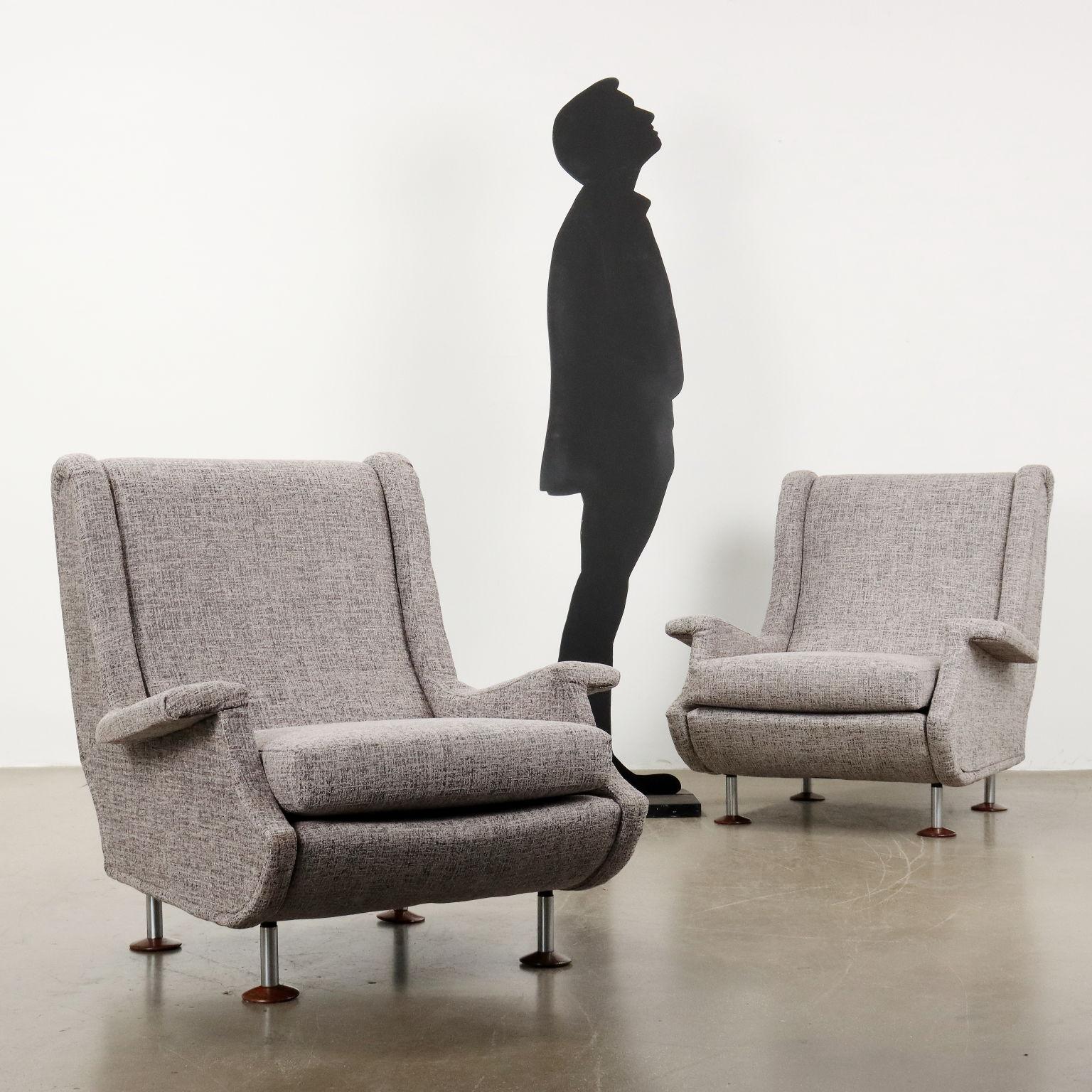 Pair of foam armchairs, fabric upholstery (not original to the period) metal legs with wooden footplate. Fully restored.