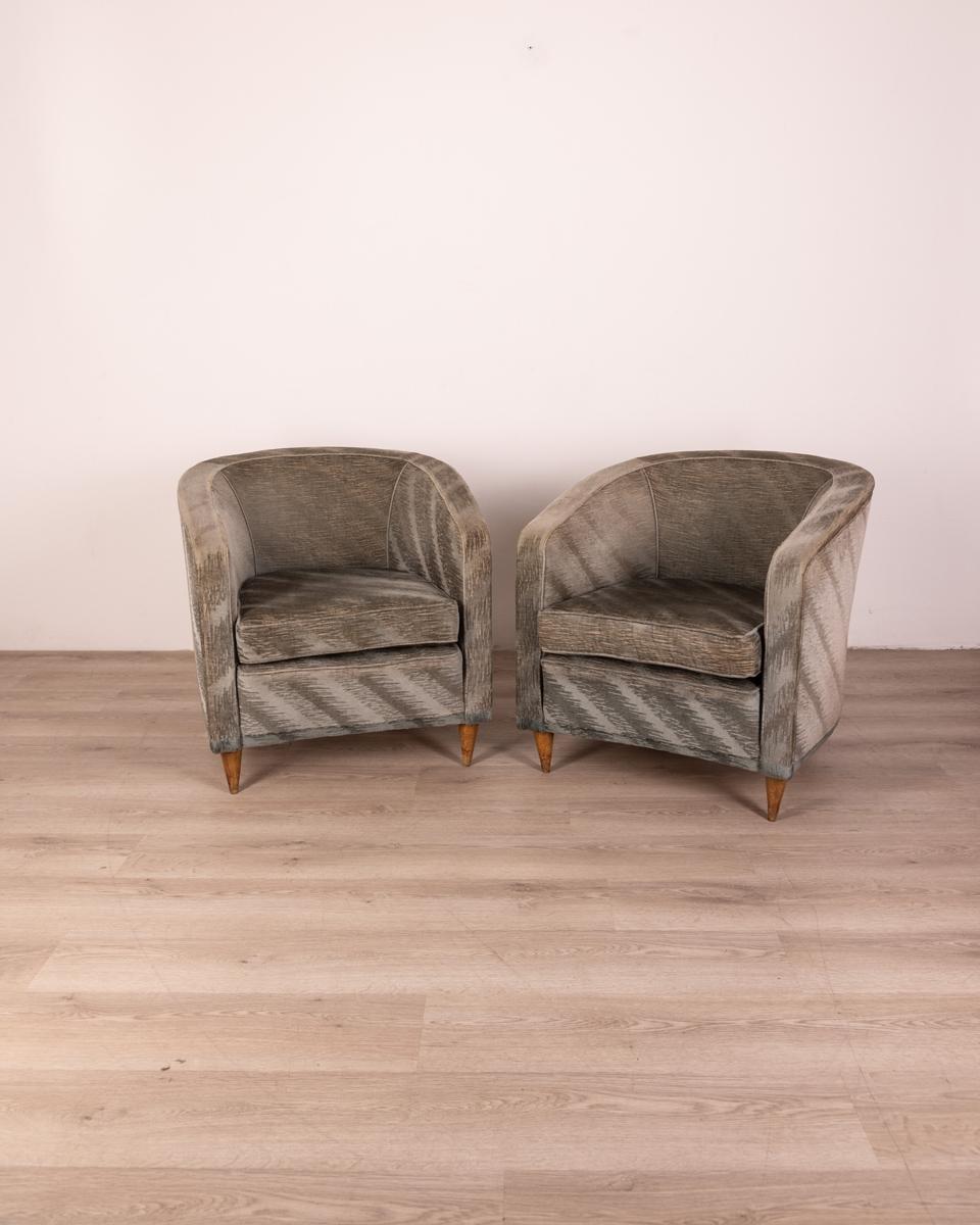 Pair of blue velvet armchairs with wooden feet, Italian design, 1950s.

CONDITION:
In good condition, showing signs of wear given by time.

SIZING:
Height 73 cm; width 75 cm; length 98 cm;