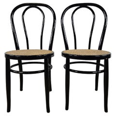 Pair of 1970s chairs in black lacquered wood with Vienna straw seat