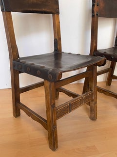 Pair of 1930s vintage natural style wood and leather chairs