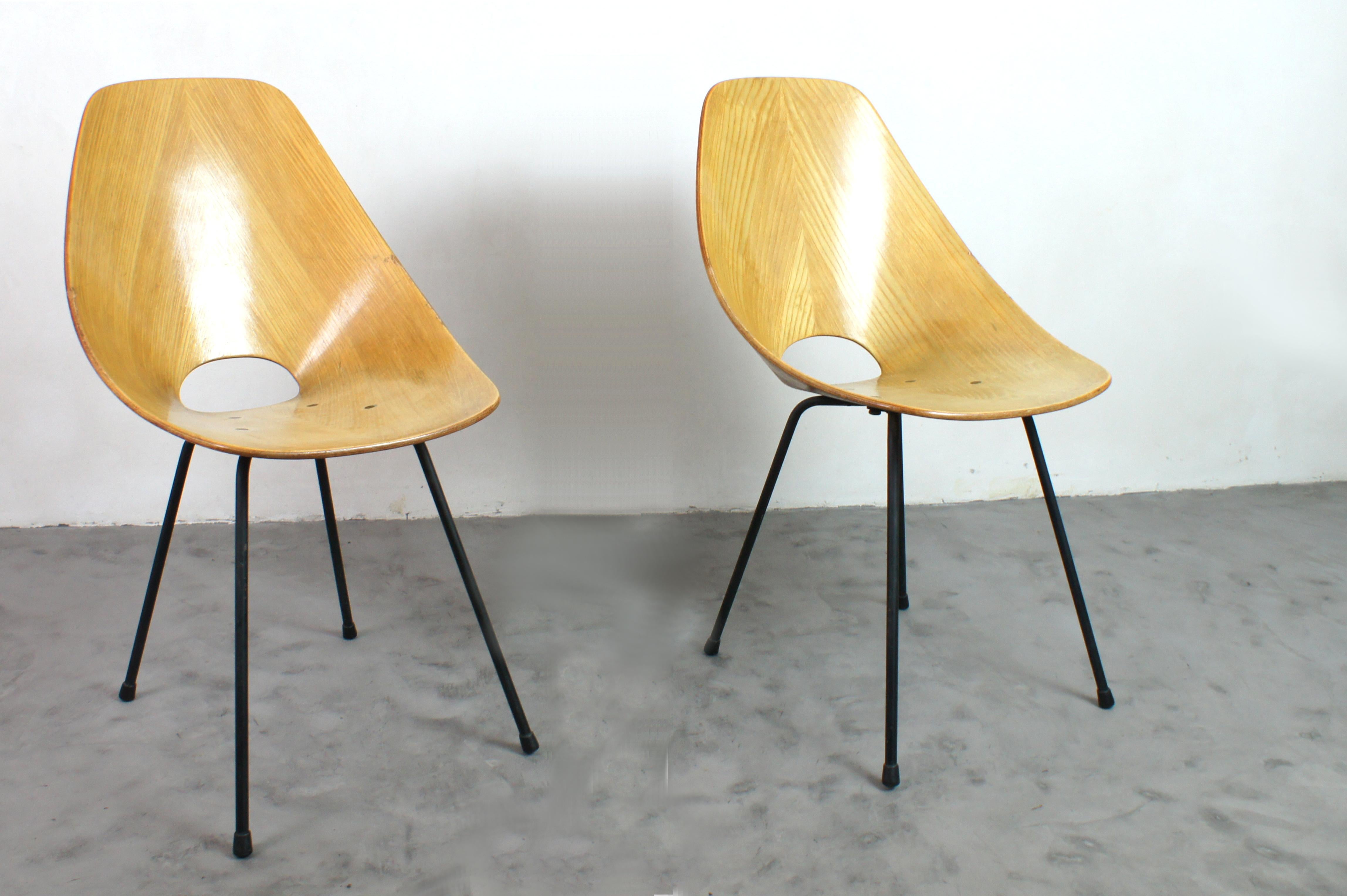 Pair of 'Medea' chairs designed by vittorio nobili and produced by tagliabue brothers. italy in the 1950s.
Curved multilayer birch wood.
Consistent patina with age and use.
Solid , stable and sturdy. 
