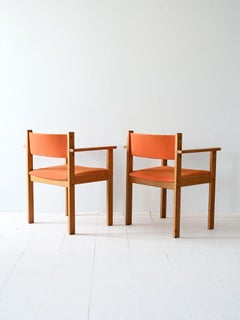 Pair of vintage chairs with armrests