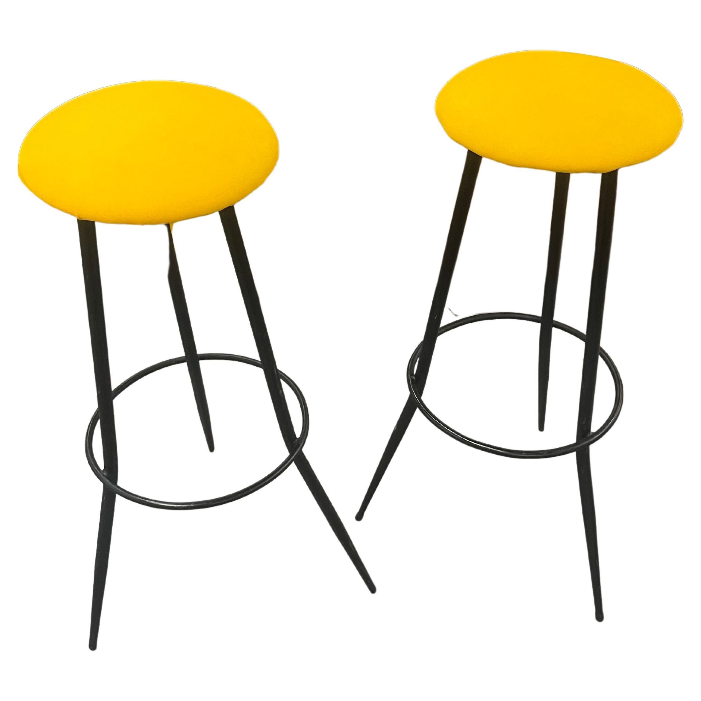 Pair of 1970s bar stools made of iron and yellow sky seat