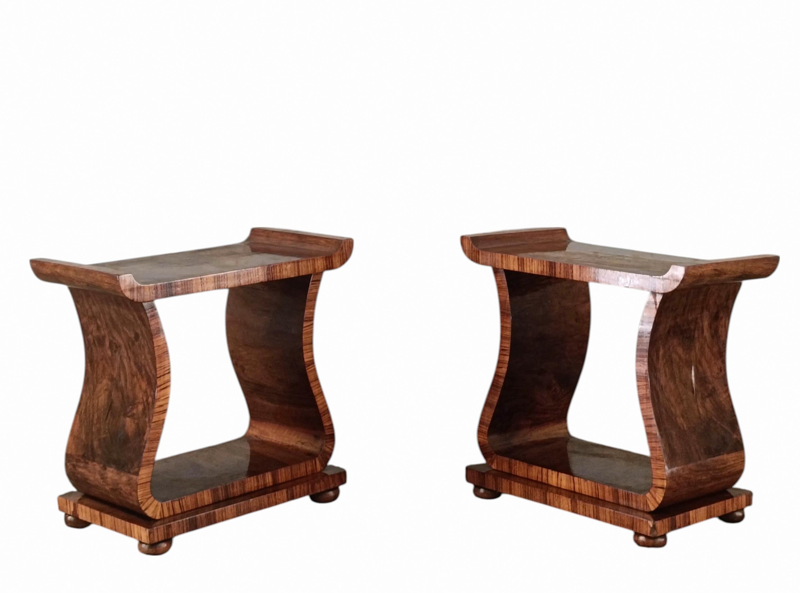 Pair of Art Deco tables in ornate walnut, of excellent workmanship,wavy line, present rectangular top and base. Of exceptional quality  have very useful dimensions for use as a coffee table or side table. The base has a beautiful U-shaped design