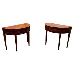 A pair of half-moon-shaped card tables in walnut and mahogany, Louis XVI style.