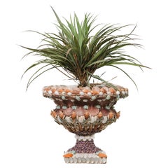 Pair of urns decorated by hand with shells