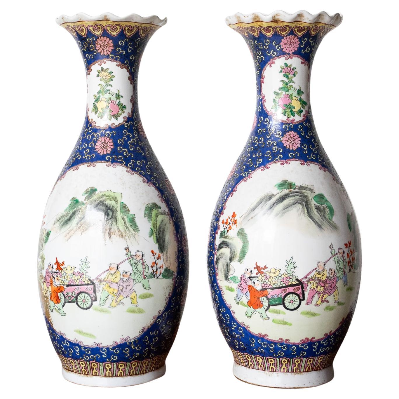 Pair Of Chinese Porcelain Vases Decorated With Various Colors
