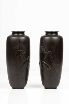 Pair of Japanese bronze vases depicting a pair of egrets