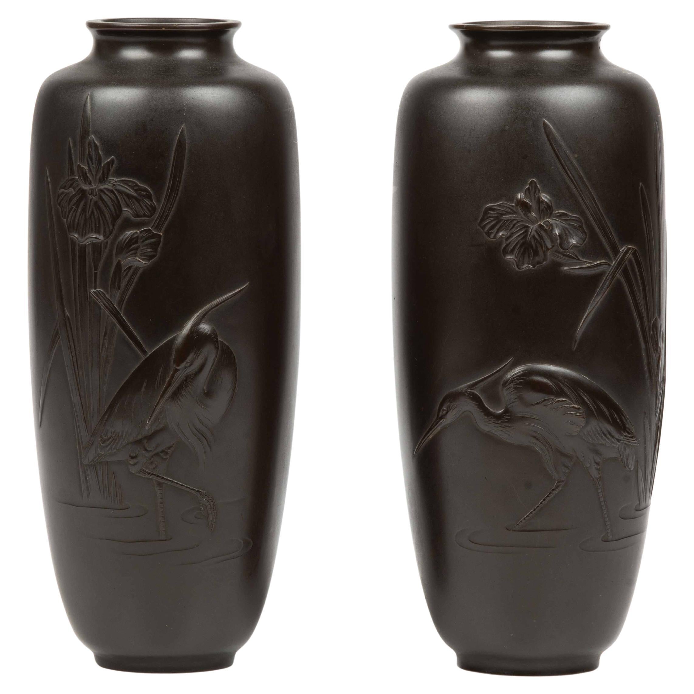 Pair of Japanese bronze vases depicting a pair of egrets