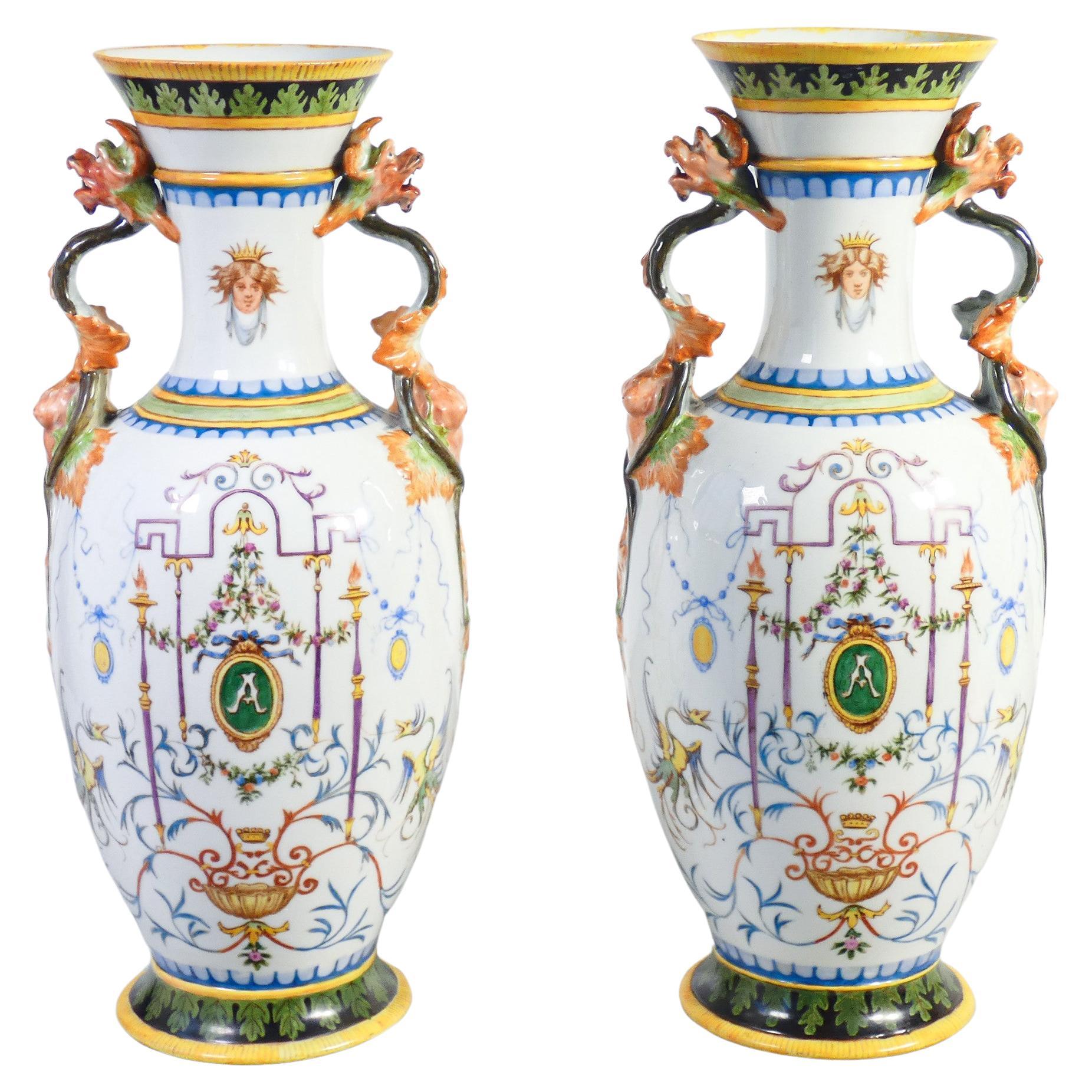 Pair of painted ceramic vases with grotesques, carvings on handles. 1887 For Sale