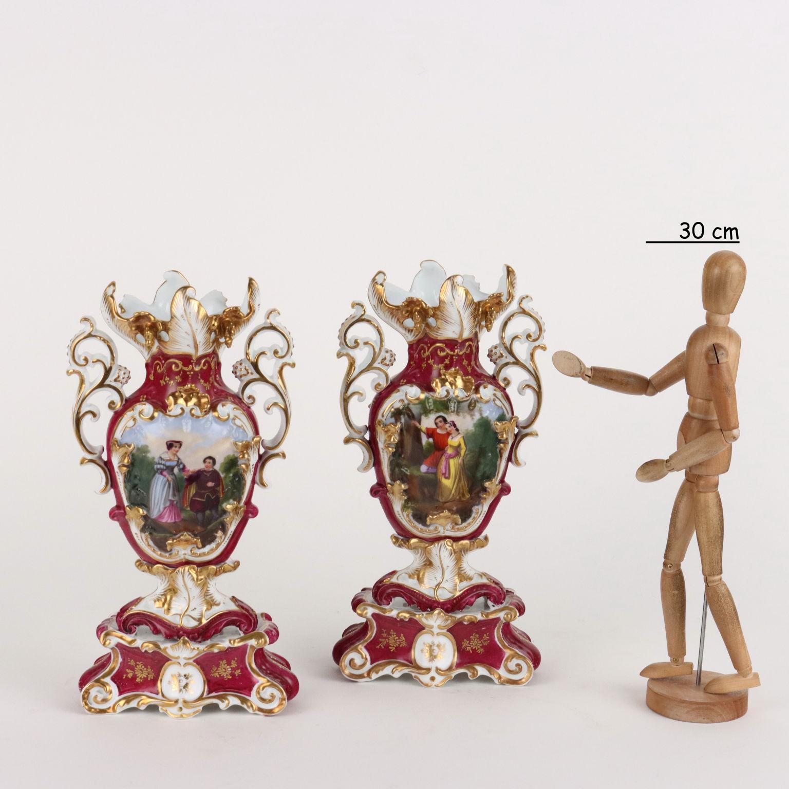 Pair of porcelain vases in the manner of Jacob Petit decorated with scenes of everyday life and bouquets of flowers in the reserves. Rich highlights in pure gold.