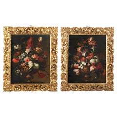 Pair of historiated vases with flowers 