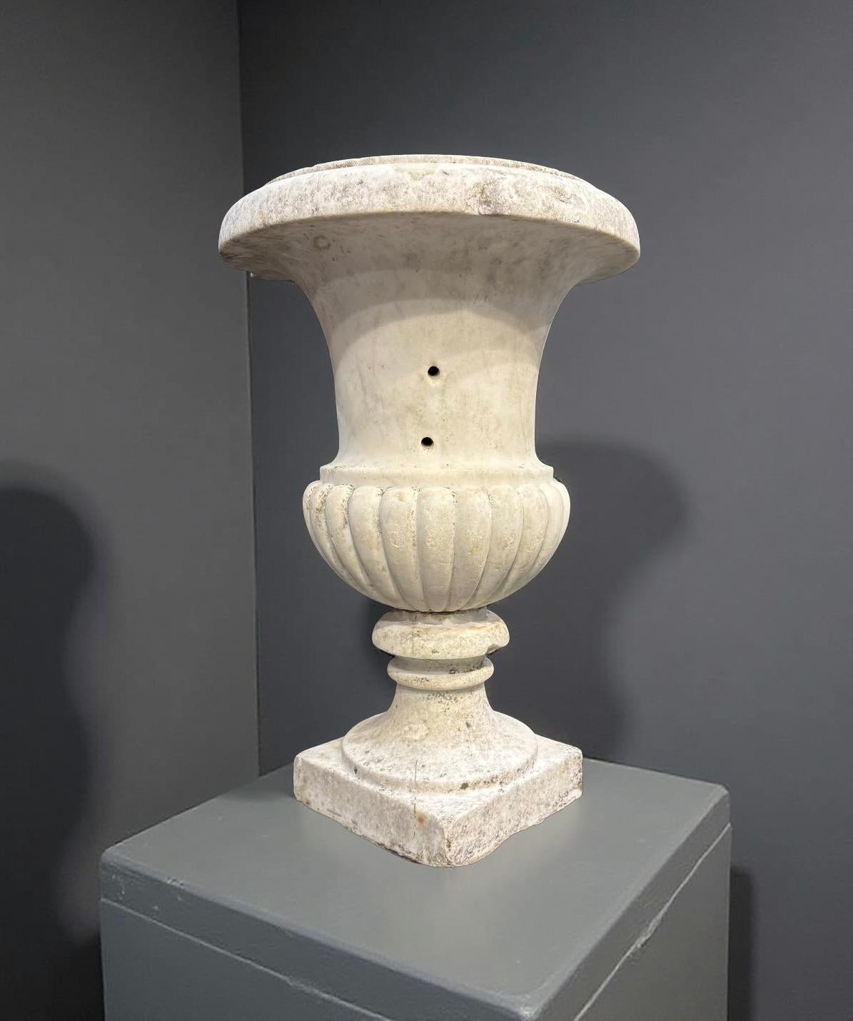 Pair of Medici vases in white Carrara marble, 17th-century Italian manufacture. 

The Medici vase is a monumental marble krater, carved in Athens by a Neo-Attic workshop around the mid-1st century BCE as a garden ornament. It was part of the