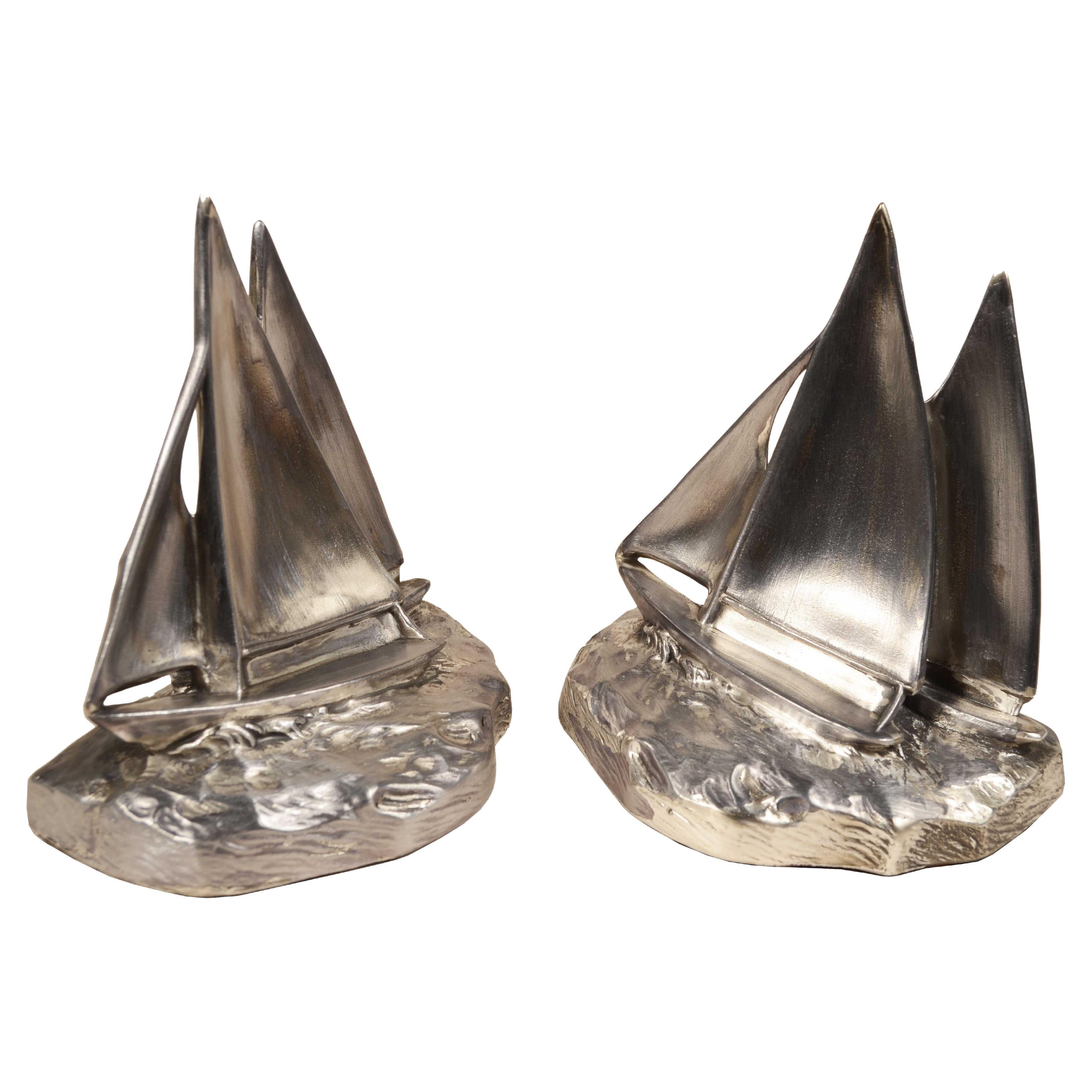 Pair of white metal cast bookends of 2 sailboats sailing 1930s