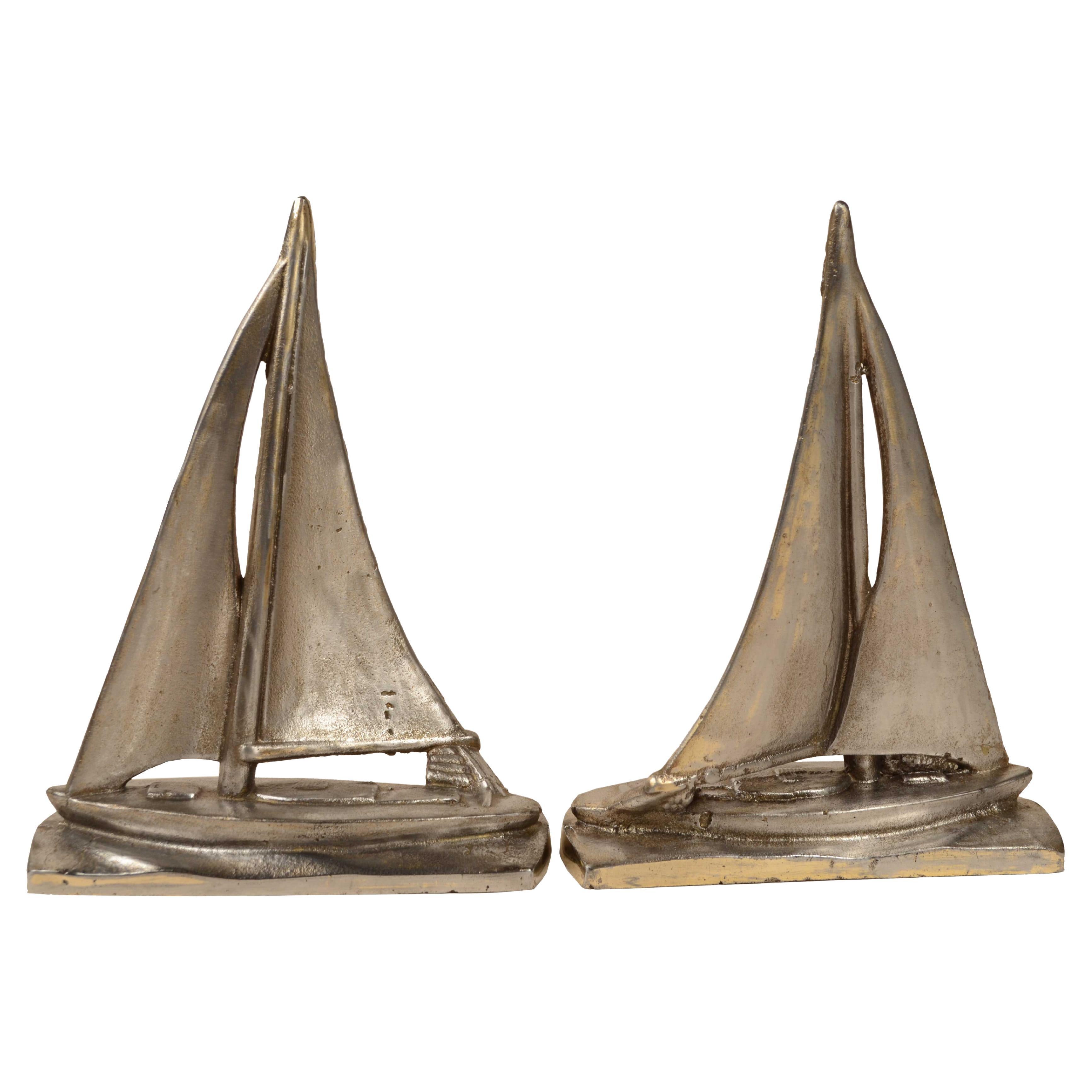 Pair of steel bookends depicting sailboat sailing circa 1930s