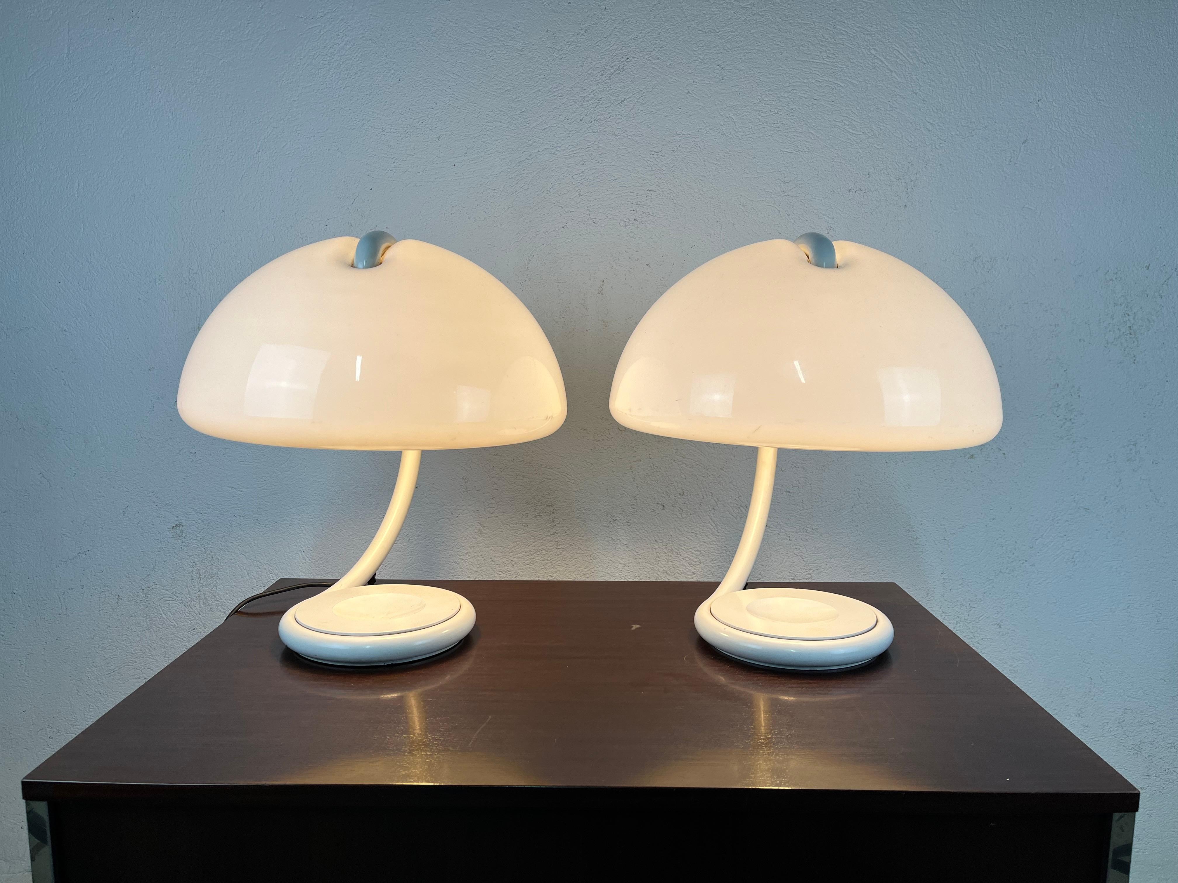 Pair of lamps in white painted metal and perspex lampshade model Cobra designed by Elio Martinelli for Martinelli Luce in the 1960s.


The lamps have been thoroughly cleaned and are in good condition, with slight marks on the frames and a small mark