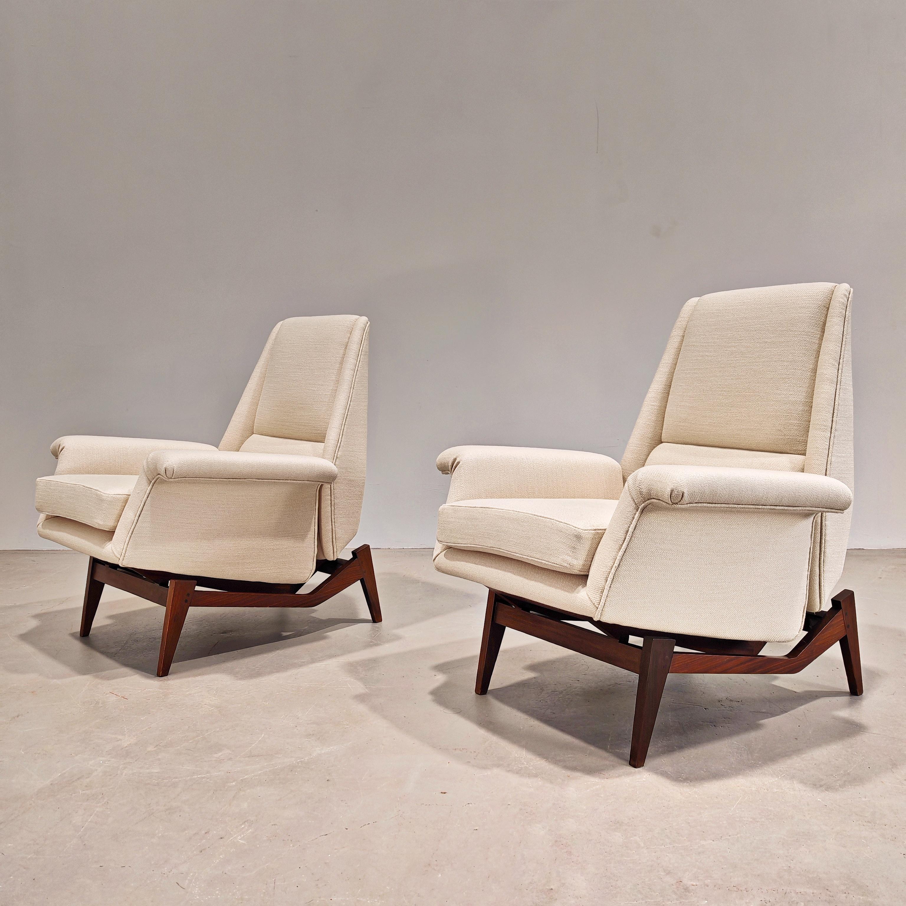 Very rare pair of Dassi production armchairs dating from the early 1960s. Sculptural teak frame and upholstery (New) in warm white cotton. The armchairs are of extreme comfort due to renewed upholstery, high back. They were reupholstered with thick