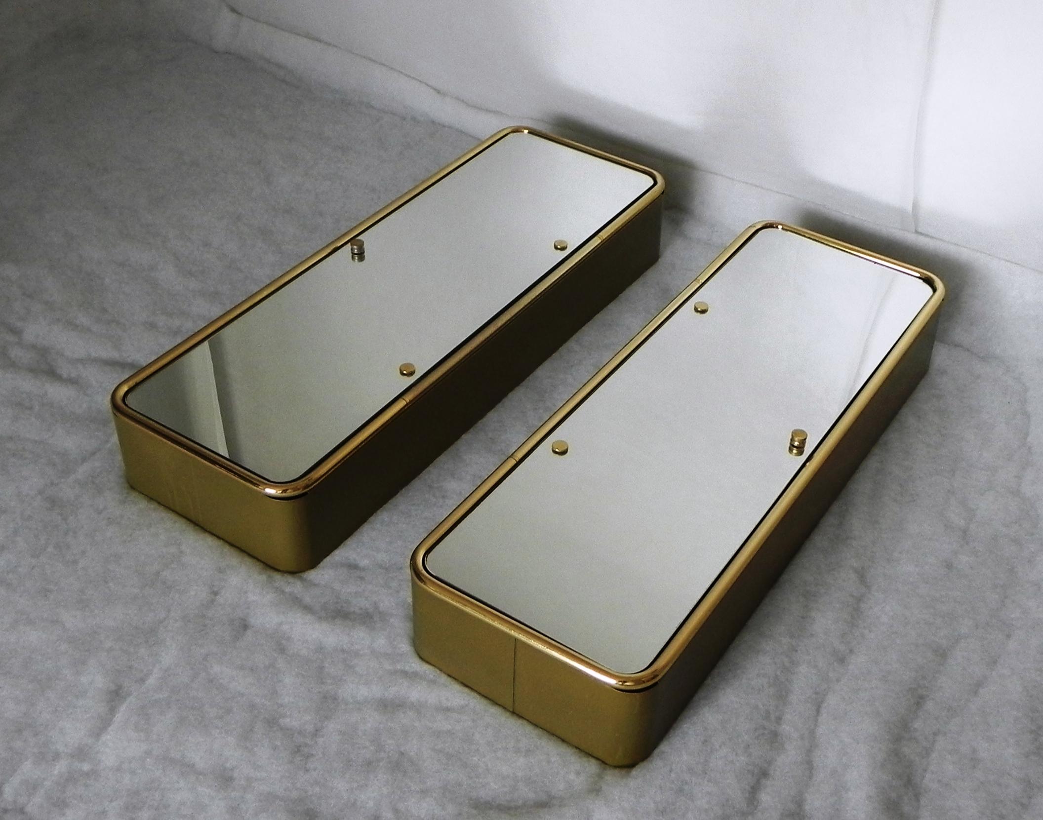 pair of bathroom storage cabinets, with mirrored doors. gold lacquered heavy metal frame, double-sided double-thickness mirror doors, crystal interior shelves. doors can be right or left. the product is of great quality construction and materials,