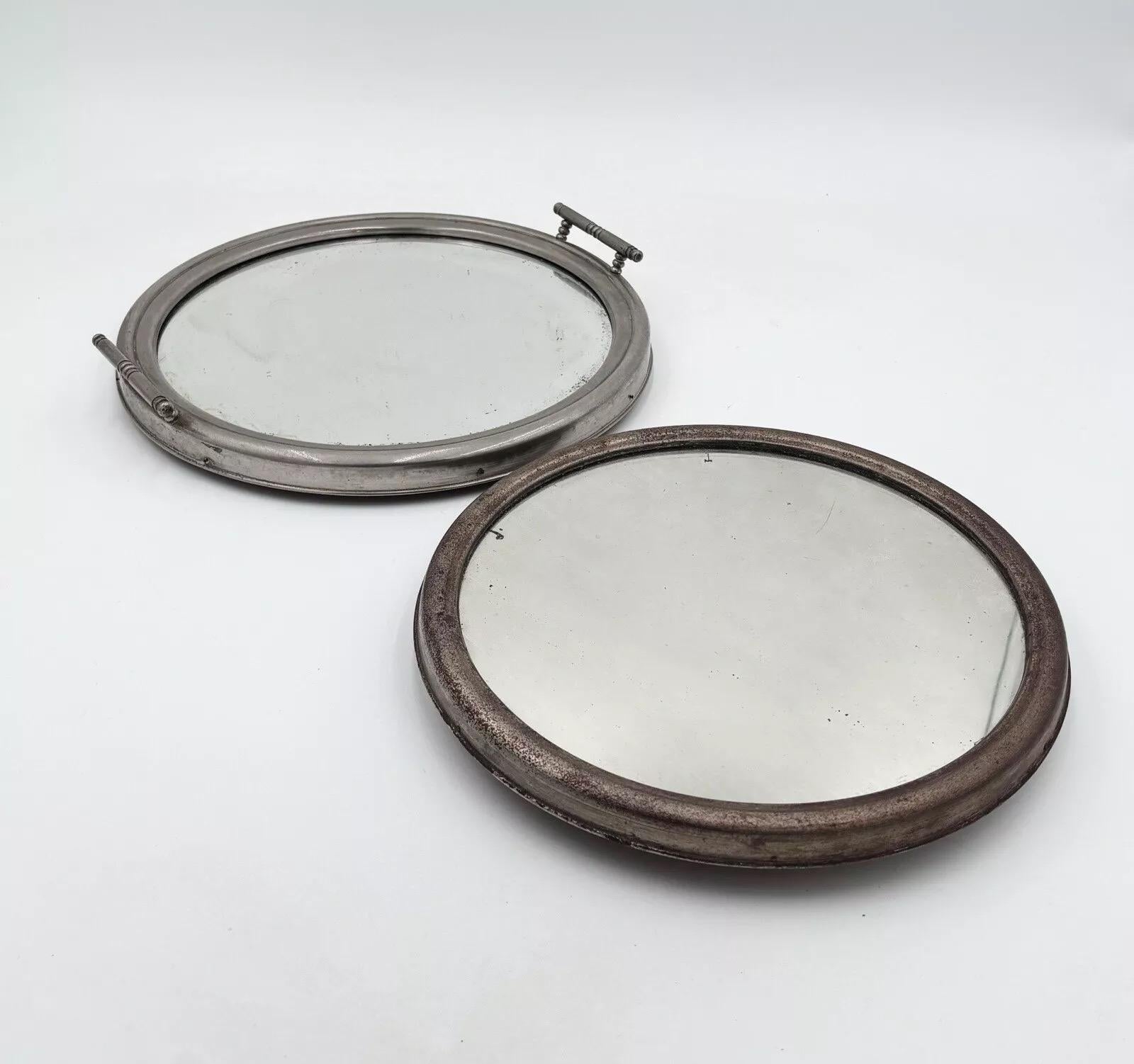 Pair of Art Deco Mirrored Trays 1940's Design.


Chrome metal frame

Signs of wear and tear present


Measurements :


Large tray diameter 28 cm

Small tray diameter 24 cm


The item is in good conservative condition, no major cosmetic or structural