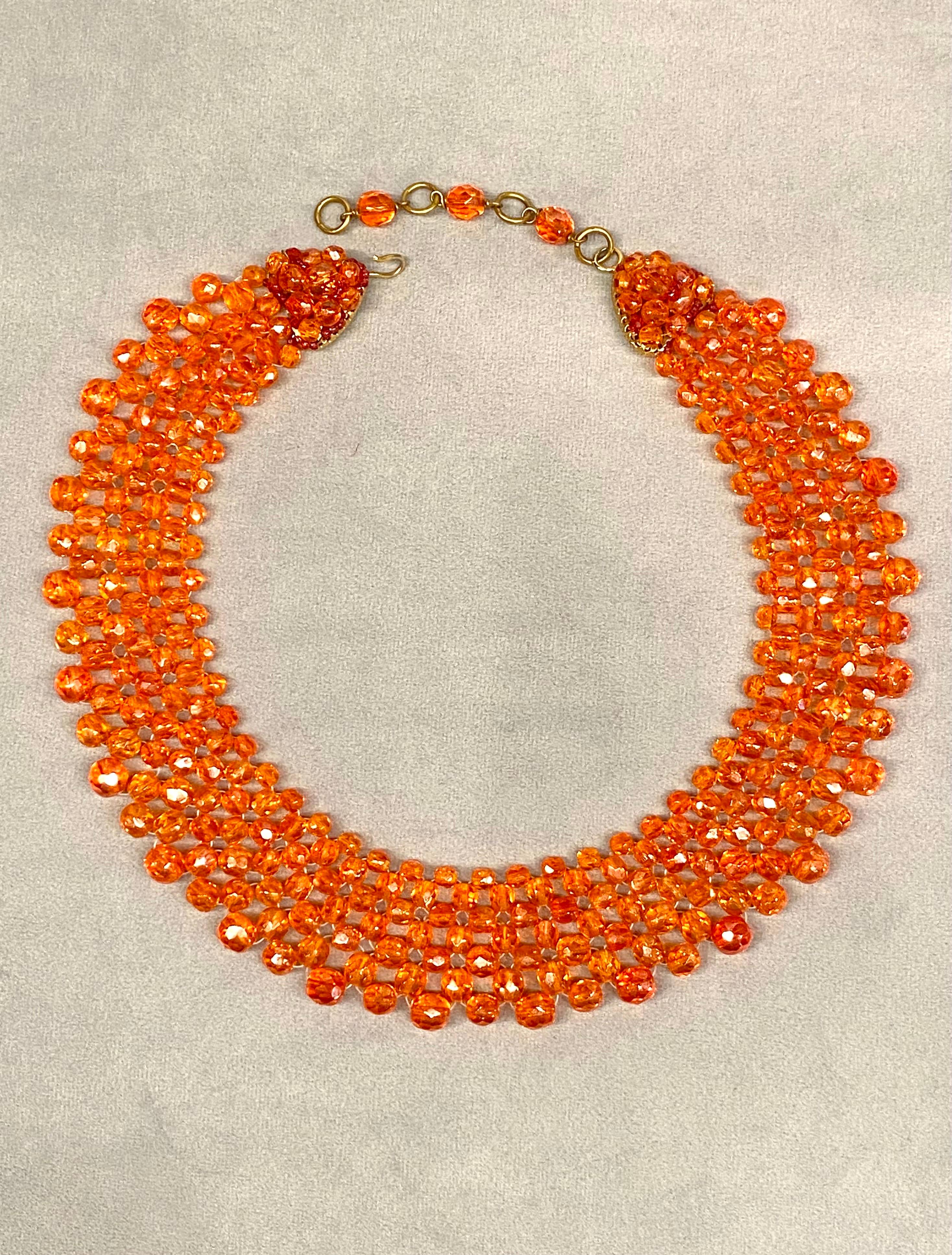 This 1950s Coppola e Toppo orange crystal bead necklace is a striking and collectible piece of jewelry. Known for their intricate beadwork and bold designs, brother and sister team Bruno and Lyda Coppola began creating their famous style of jewelry