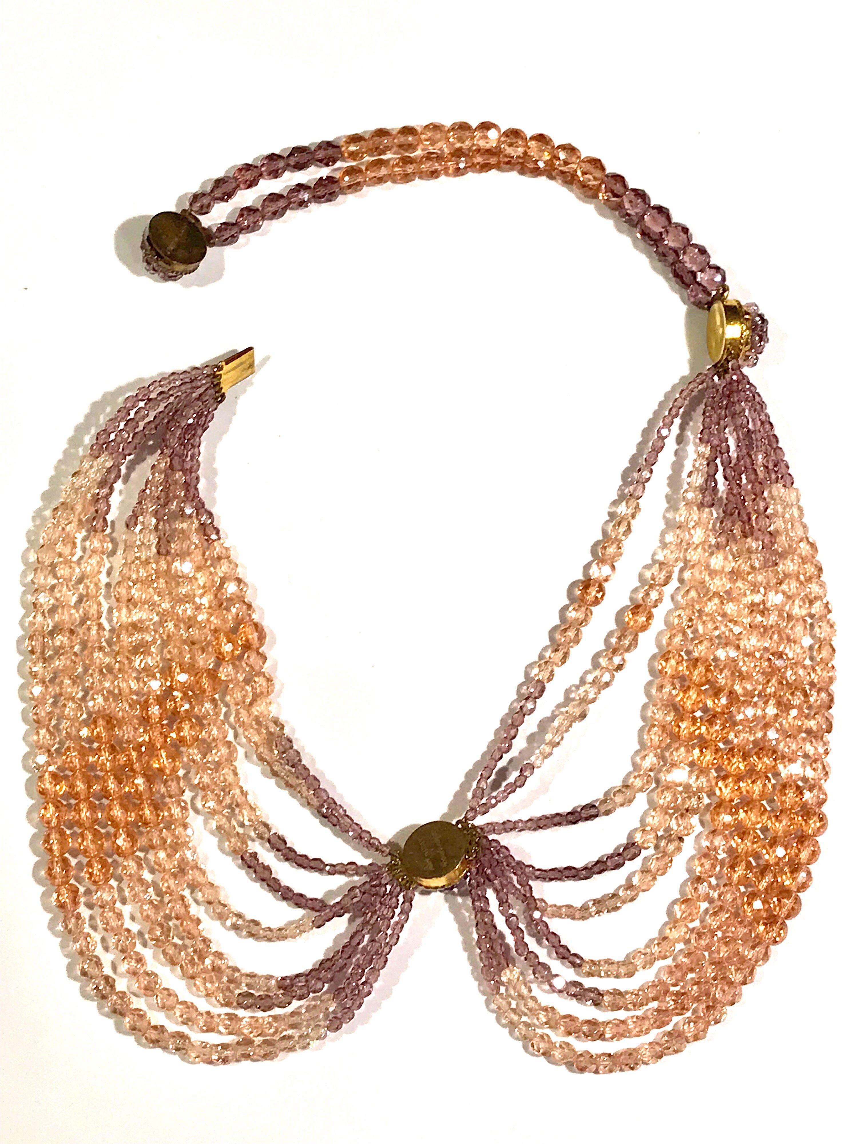 A lovely crystal bead swag necklace by Coppola e Toppo for designer Ken Scott from the 1960s. The crystals are graduated in size from the smallest approximately 3 mm to the largest approximately 7 mm. There are two shades of pastel pink / coral