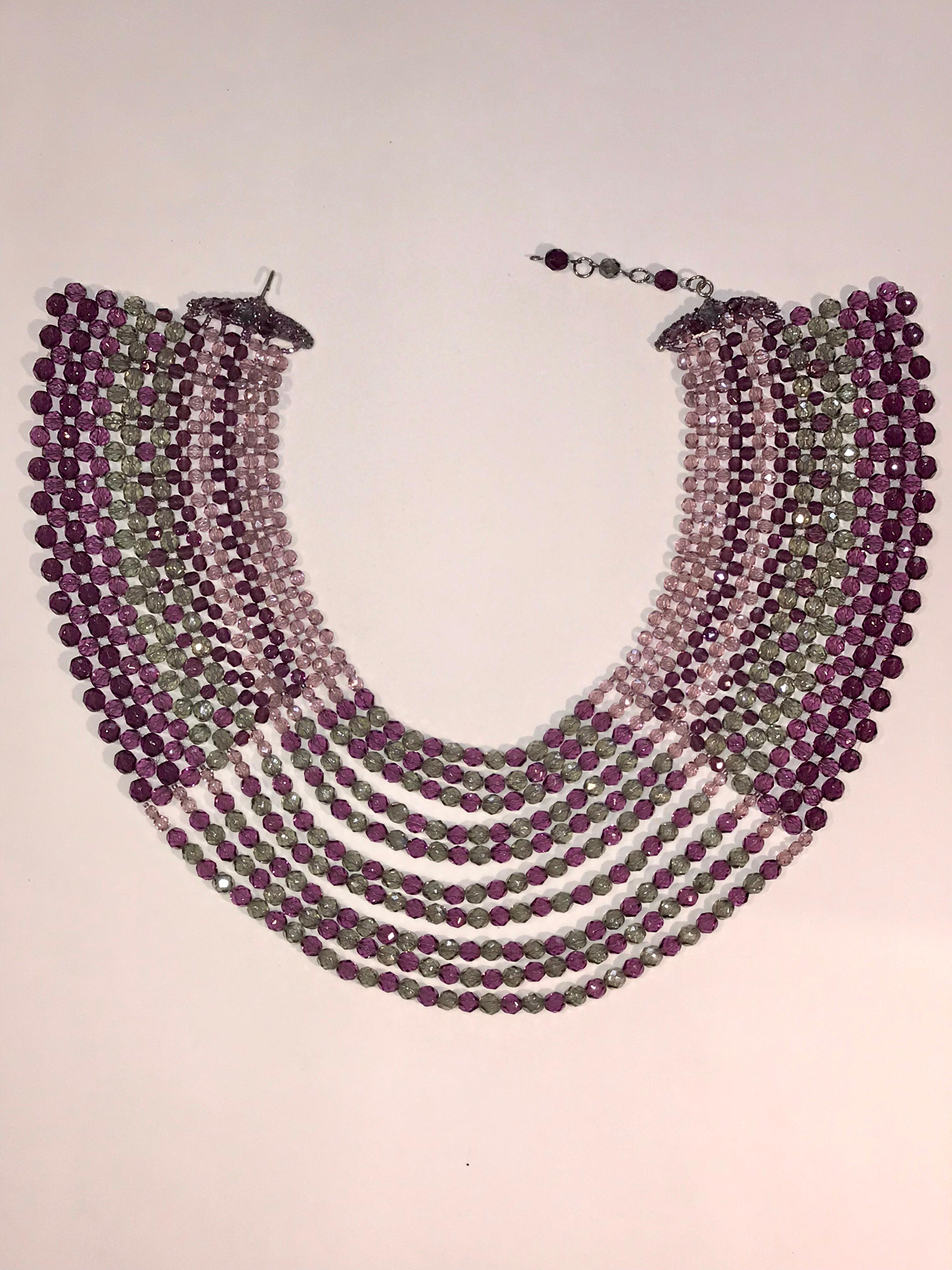 An impressive late 1960s to mid 1970s faceted crystal bead collar necklace by famous jewelry company Coppola e Toppo. This necklace is 3.75 inches of woven and swag pale purple, sage green and amethyst color crystal beads in three size beads. The