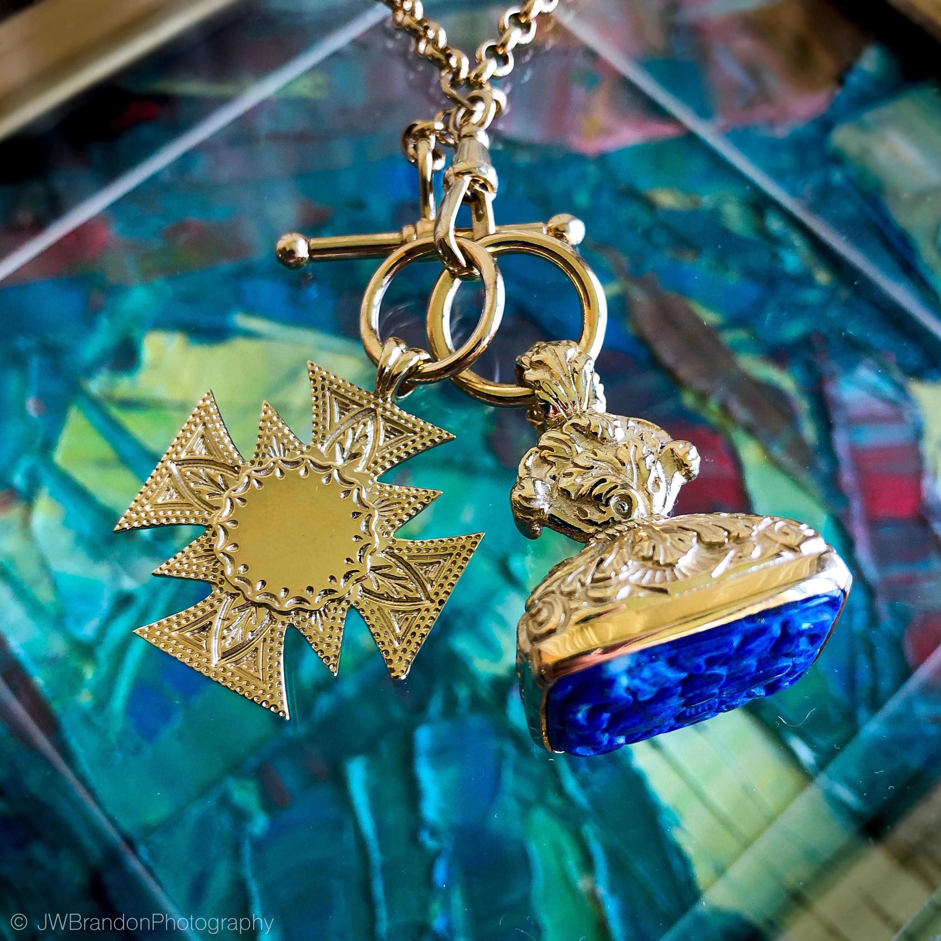 Dudley VanDyke's Coptic Cross Fob is featured in 14K Yellow Gold with a multisided engraveable starburst.  Also known as an Ethiopian Cross, the Coptic Cross Fob is available as a 14K Yellow Gold and Sterling Silver mixed metal fob and by custom