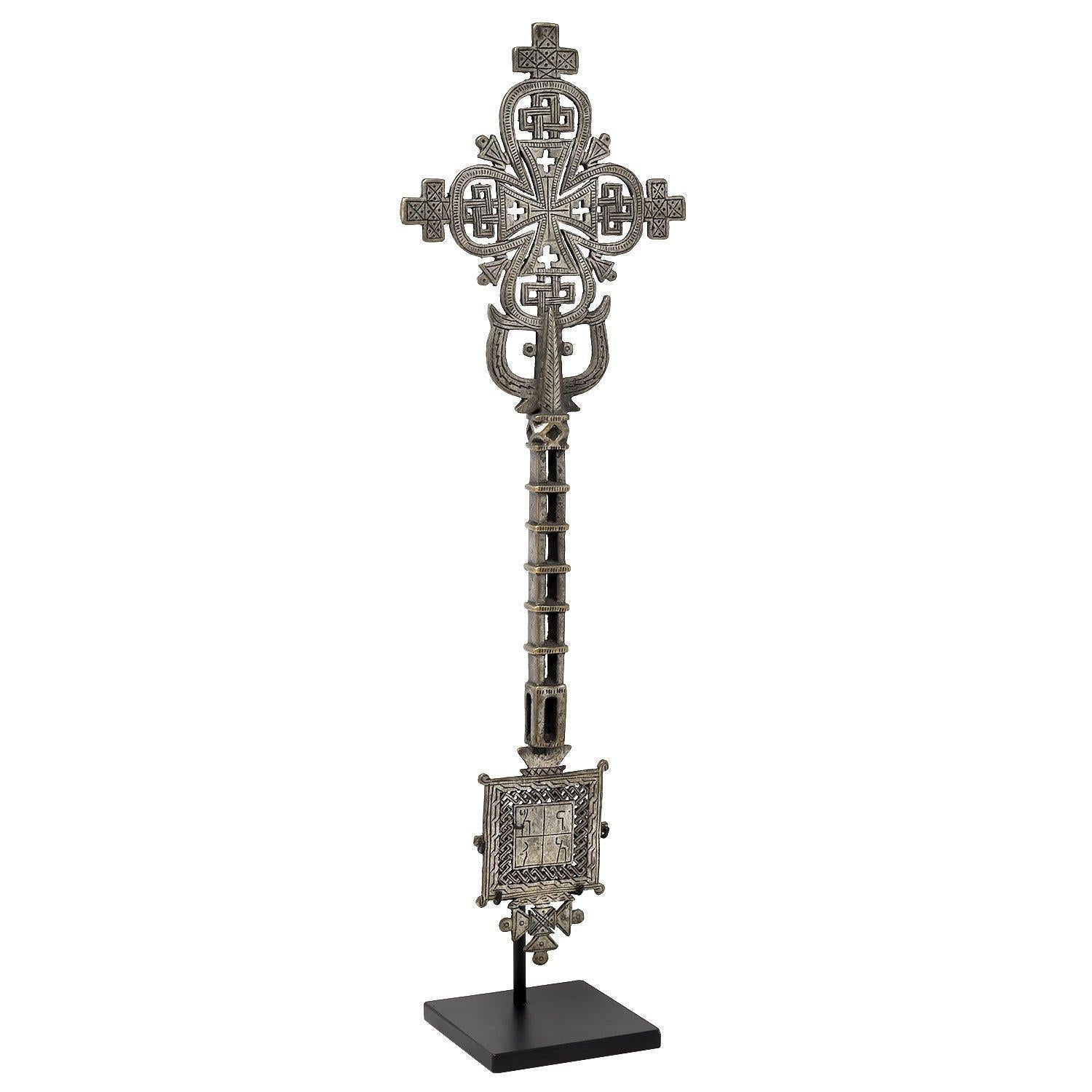 Coptic hand cross, Ethiopia

Carried by hand during services
Silver-plated copper alloy
Mid 20th century
Measures: 17.75 x 5.75 x 0.625 in. / 45 x 15 x 1.5 cm
Height on custom display stand: 19.25 in. / 49 cm.
