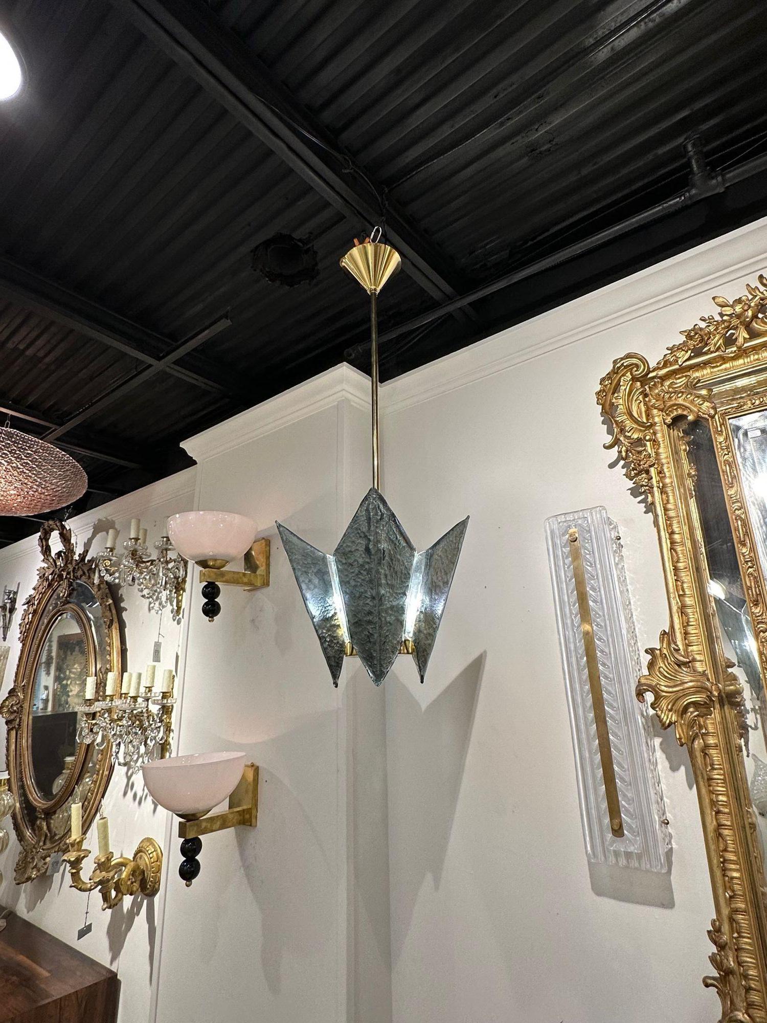 Modern Murano glass and brass pendant light in Fontana green. The chandelier has been professionally re-wired, cleaned and is ready to hang. Includes matching chain and canopy. This is available for custom orders in quantity and colors.
