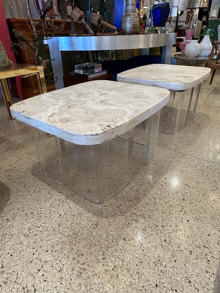 This pair of thick (2 inch top) and heavy natural infilled travertine stone slabs on top of sturdy curved shape Lucite bases to create some wonderful and whimsical side tables.  THIS ITEM IS LOCATED AND WILL SHIP FROM OUR EAST HAMPTON, NY SHOWROOM.