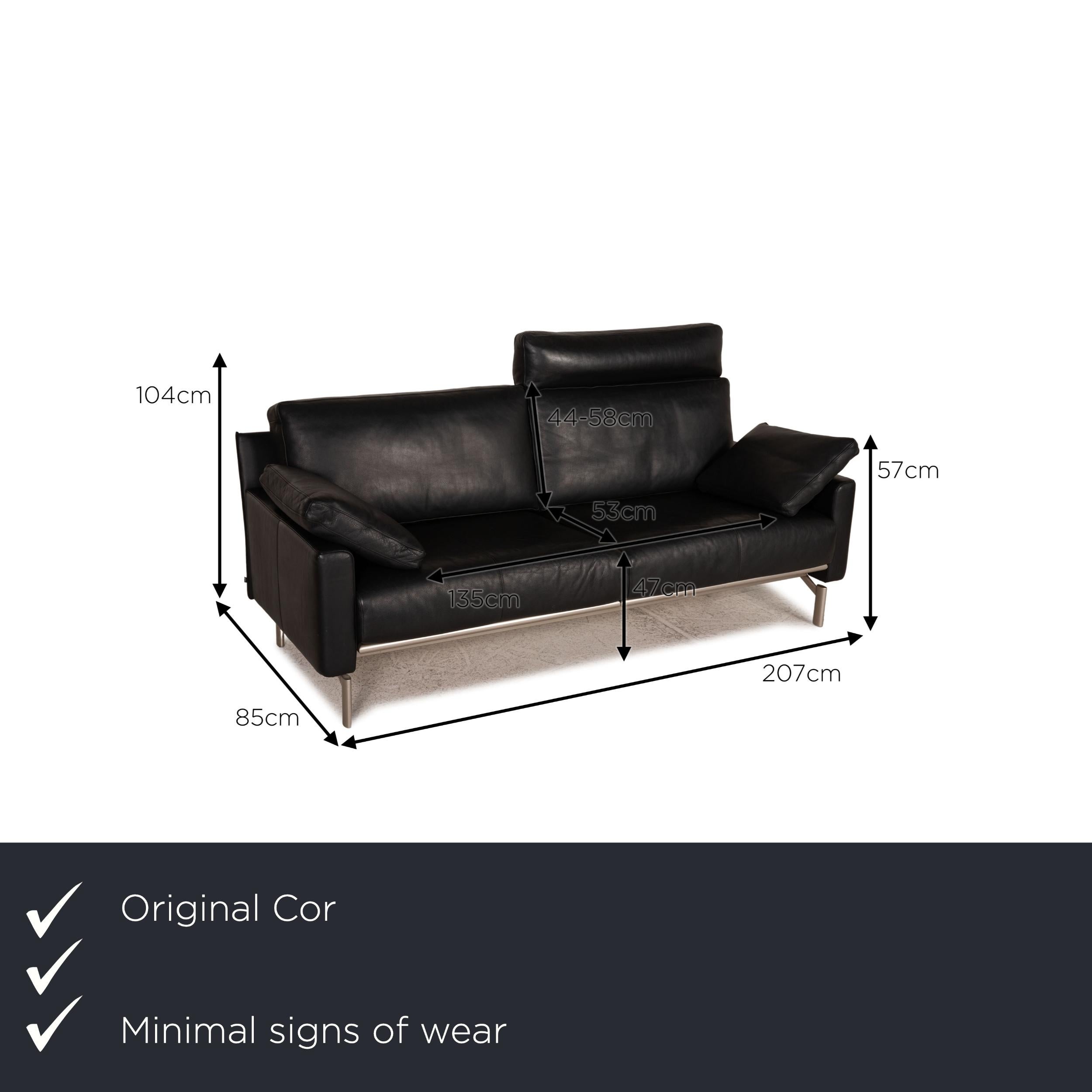 We present to you a Cor Ala leather sofa black three seater couch.

Product measurements in centimeters:

depth: 85
width: 207
height: 104
seat height: 47
rest height: 57
seat depth: 53
seat width: 135
back height: 44.

 