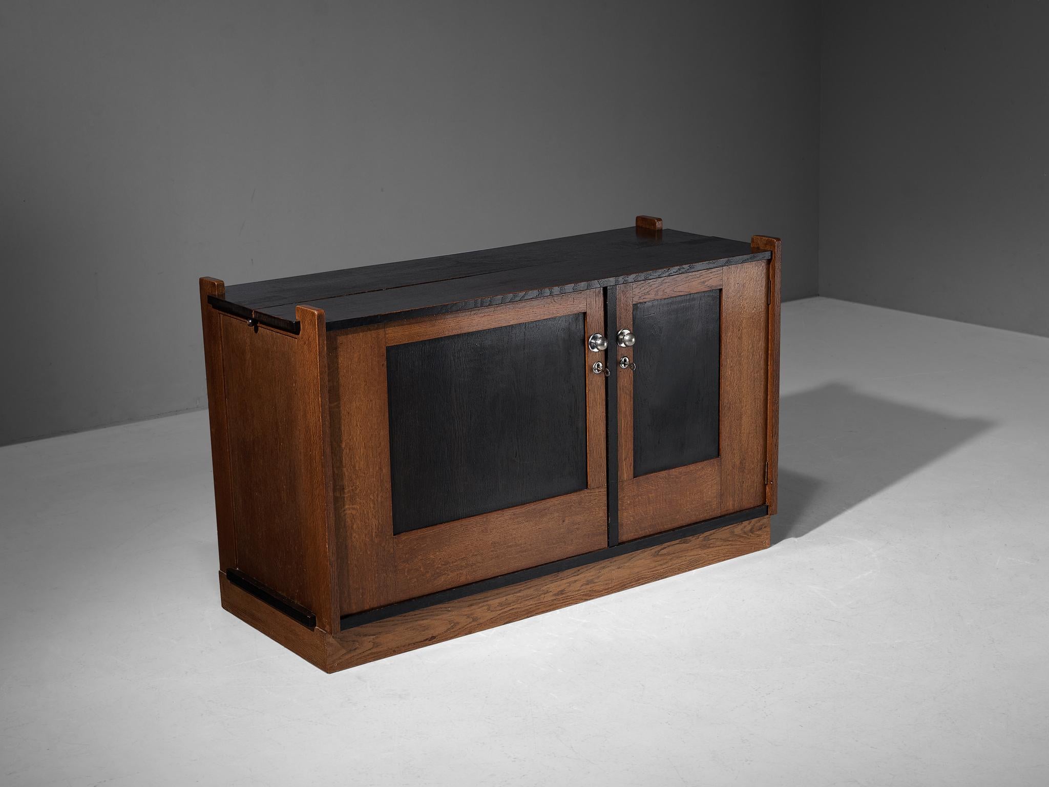 Cor Alons cabinet, manufactured by Winterkamp en van Putten, oak, stained oak, The Netherlands, 1927

This cabinet was designed by Cor Alons, in the period of the 'Hague School', a movement that emphasized geometric shapes, simple proportions and