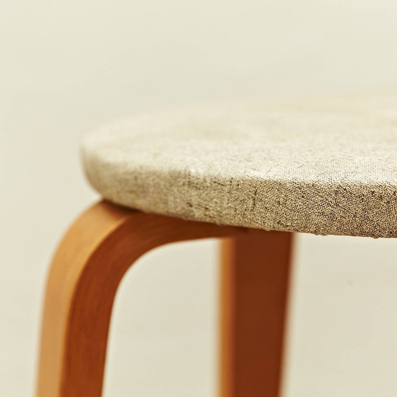 Stools designed by Cor Alons, circa 1950.
Manufactured by Den Boer Gouda (Netherlands), circa 1950.
Laminated birchwood plywood and original upholstery.

In original condition, with minor wear consistent with age and use, preserving a beautiful