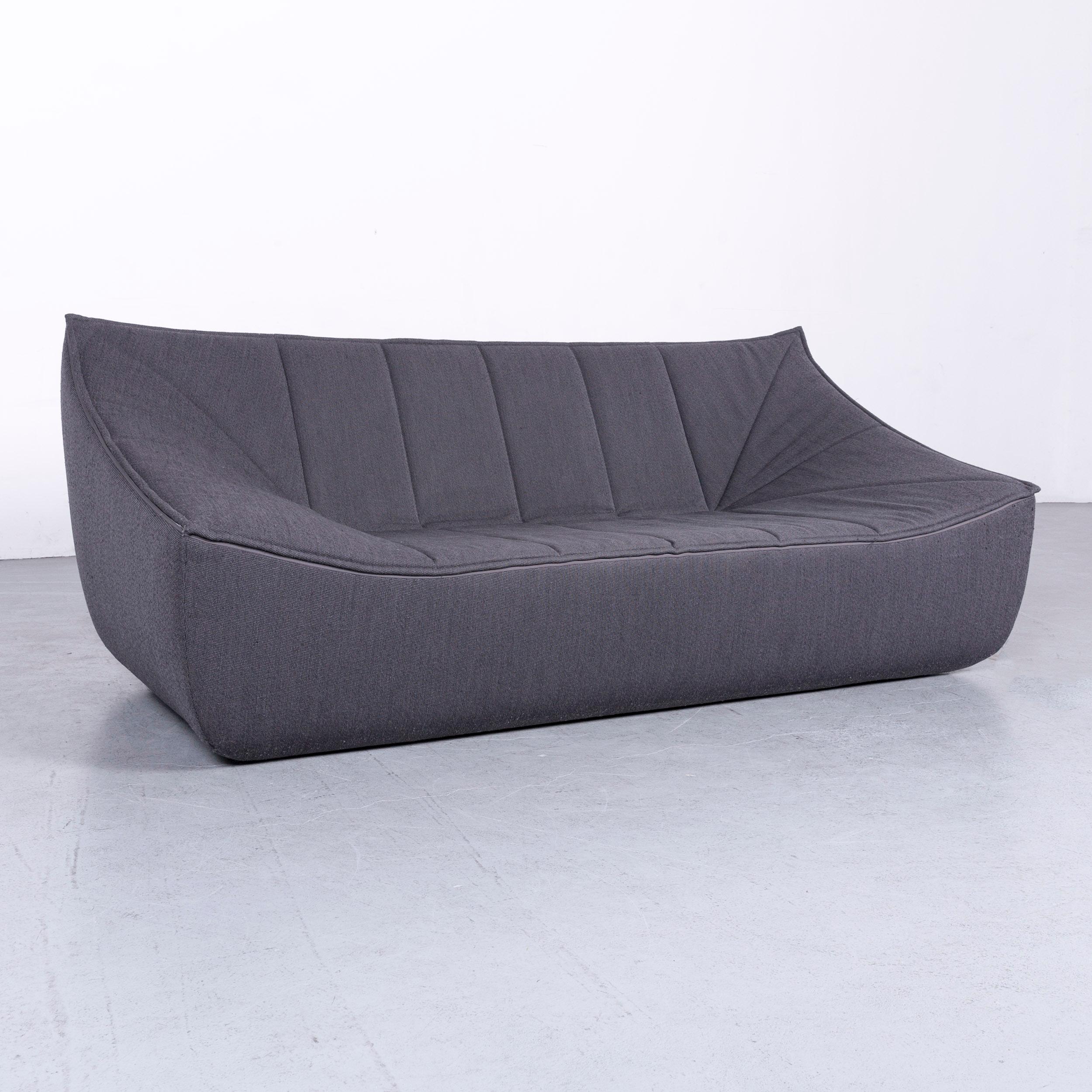 We bring to you a COR Bahir designer fabric sofa grey three-seat couch.















 