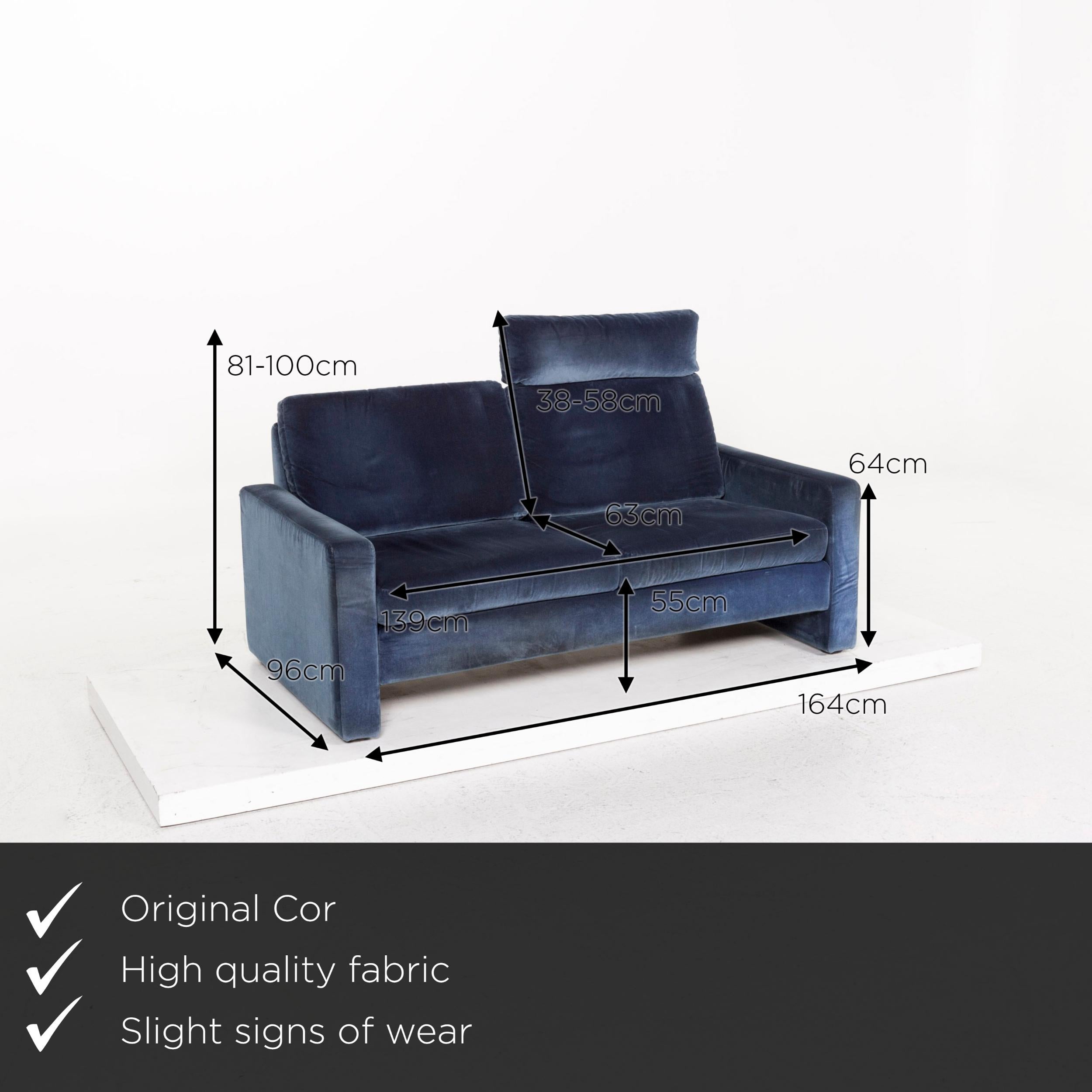 We present to you a COR Conseta fabric sofa blue two-seat function couch.
   
 

 Product measurements in centimeters:
 

Depth 96
Width 164
Height 81
Seat height 55
Rest height 64
Seat depth 63
Seat width 139
Back height 38.
   